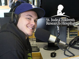 The Voice of the Negaunee Miners Carl Leander Johnson sitting in the 103 FXD studios on Day 2 of the 2014 St. Jude Children's Research Hospital Radiothon