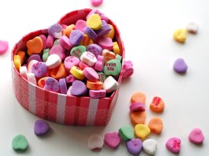 conversation hearts in a heart shaped box
