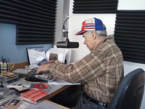 Elmer Aho getting ready to answer your phone calls Labor Day Weekend on American Country Gold