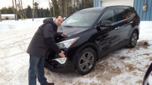Nick standing next to the newly repaired Hyundai Sanata Fe