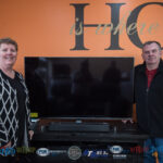 The McLarens with their brand new 55" 4K LG Smart TV, LG Soundbar, LG Blu-ray Player and TV stand.