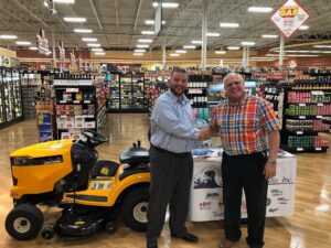 Tadych's Econo Foods Store Manager Zach and Great Lakes Radio's Todd Noordyk in front of the grand prize.