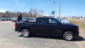 Brandee Korpi in the bed of a new Silverado