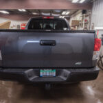 The rear bumper was totally repaired after being hit with a trailer hitch